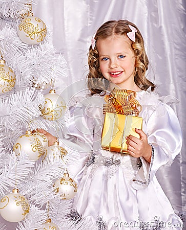 Child decorate Christmas tree. Stock Photo