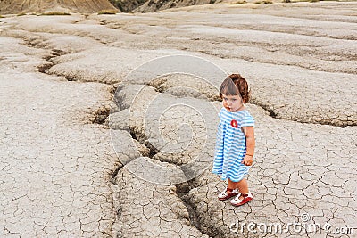 Child in a desert land Stock Photo