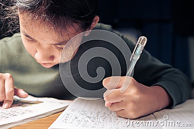 Child do a handwriting homework Stock Photo