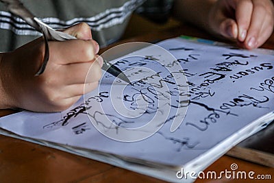 A child doing calligraphy writing Stock Photo