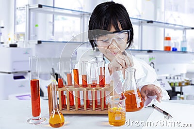 Child doing chemical research in lab Stock Photo