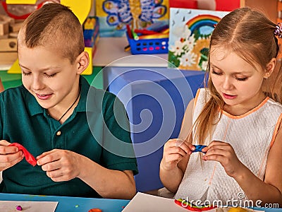 Child dough play in school. Plasticine for children. Stock Photo
