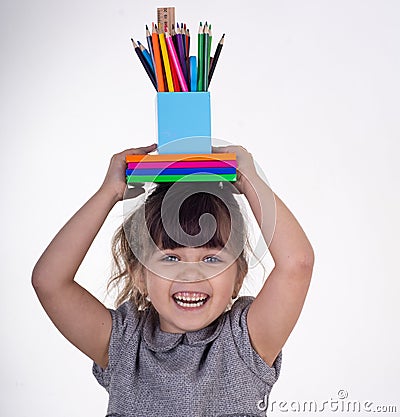 Creative child over white background. Office supply objects collection. Stock Photo