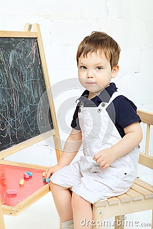 Child Drawing With Chalk Stock Photo