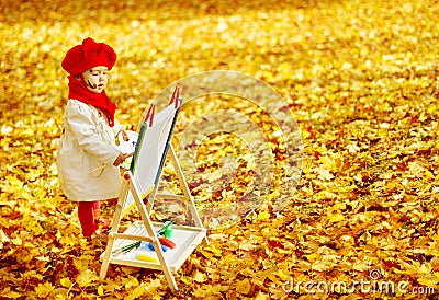 Autumn Baby Girl Drawing in Fall Leaves Park, Kid Painting Stock Photo