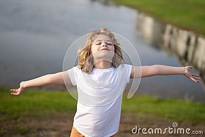 Child dreams of nature. Carefree kid dreaming on summer nature. Childhood dream concept. Blonde cute daydreamer child Stock Photo