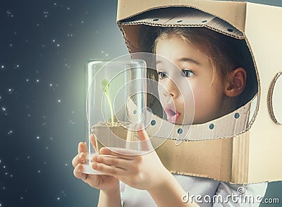 Child is dressed in an astronaut costume Stock Photo