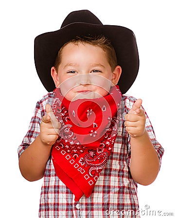 Child dressed up as cowboy playing Stock Photo