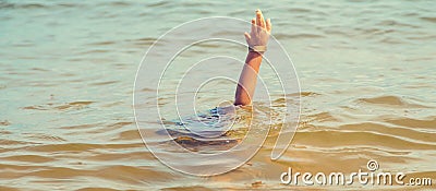 A child drowns in water at sea. Selective focus Stock Photo