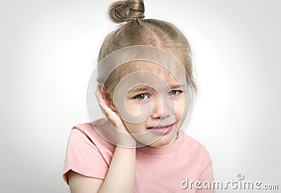 Child with earache, toddler girl portrait ear pain concept Stock Photo