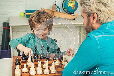 Child early development. Boy think or plan about chess game - style for education concept. Nice concentrated little boy Stock Photo