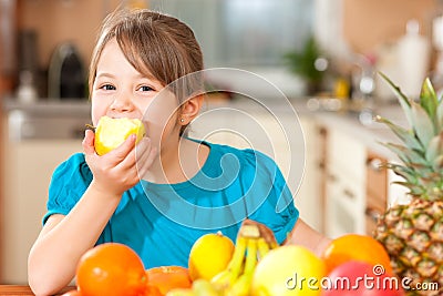 Child eating an apple Stock Photo