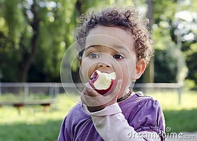 Child eating apple Stock Photo