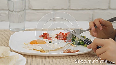Child Eating Breakfast in Kitchen, Kid Eats Healthy Food Eggs, Girl Vegetables Stock Photo