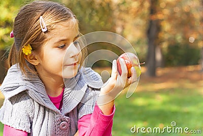 Child eating fresh apple Stock Photo