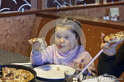 Child eating pizza Stock Photo