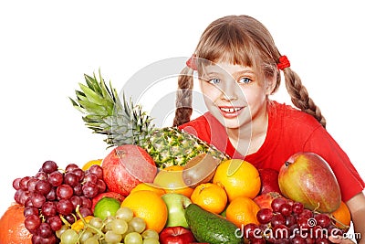 Child eating vegetable and fruit. Stock Photo