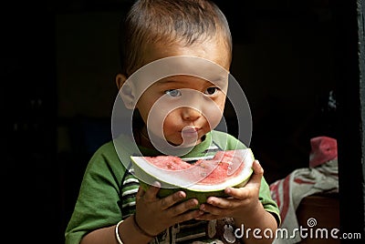 Child eating watermelon Editorial Stock Photo