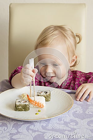 Child eats sushi, rolls, Stock Photo