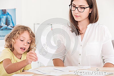 Child education therapist using props during a meeting with a kid with problems Stock Photo