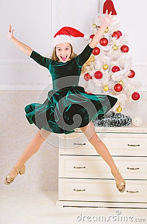 Child emotional cant stop her feelings. Celebrate christmas concept. Girl in dress jumping. It is christmas. Day we have Stock Photo