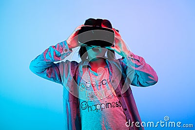 Child experimenting with virtual reality headset Stock Photo