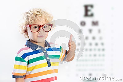 Child at eye sight test. Kid at optitian. Eyewear for kids. Stock Photo