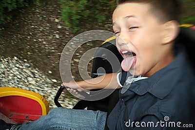 Child in fairground ride Stock Photo