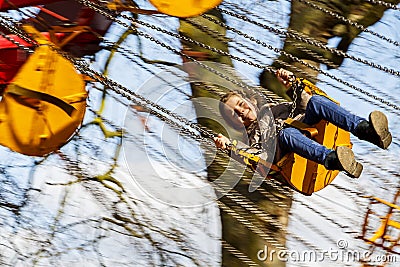 Child on Fairground Ride Editorial Stock Photo