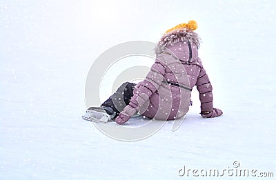 Child falling on the skating rink Editorial Stock Photo