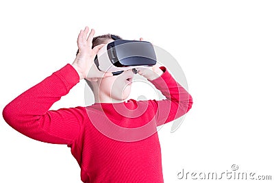 Child fascinated with his virtual reality glasses Stock Photo