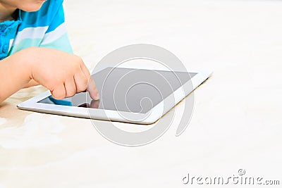 Child finger with touch pad, early education Stock Photo