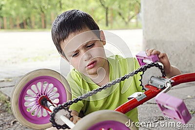 Child fixing and reparing Stock Photo