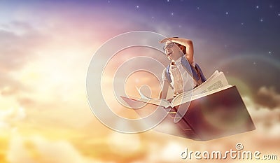 Child flying on the book Stock Photo