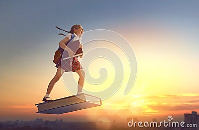 Child flying on the book Stock Photo