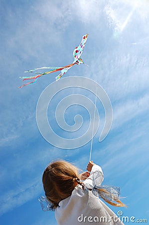Child flying a kite Stock Photo