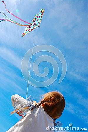 Child flying a kite Stock Photo