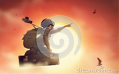 Child flying on a suitcase Stock Photo