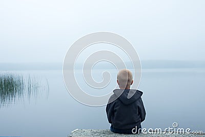 Child in foggy day Stock Photo