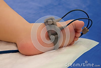 Child foot with oxymeter Stock Photo