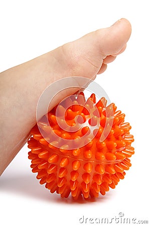 Child foot with plastic massage ball Stock Photo