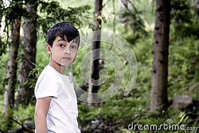 The child in the forest, escaped from the house and was lost, the heavy relations in family, trouble, disagreement, physical Stock Photo