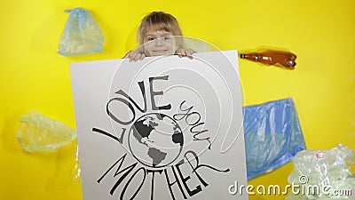 Girl activist holding poster Love Your Mother Earth. Plastic nature pollution Stock Photo