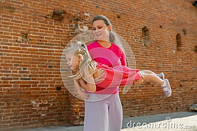 Child girl with cochlear implant with her mother spend time outdoor. Hear impairment and deaf community concept. Deaf Stock Photo