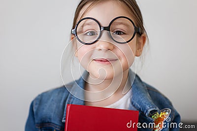 child girl in glasses with book textbook. portrait of student Stock Photo