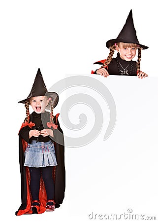 Child girl in Halloween witch costume with banner. Stock Photo