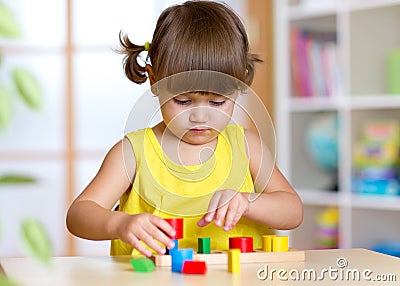 Child girl kid playing with sorter toys Stock Photo