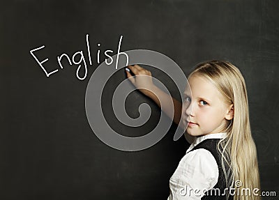 Child Girl Learning English on the School Classroom Blackboard Stock Photo