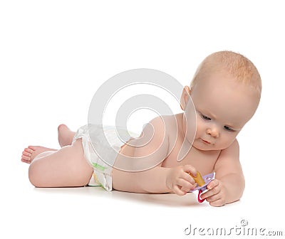 Child girl lying with baby nipple soother Stock Photo