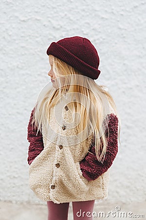 Child girl outdoor fashion outfit kid wearing hat and fluffy sherpa jacket winter stylish clothing Stock Photo